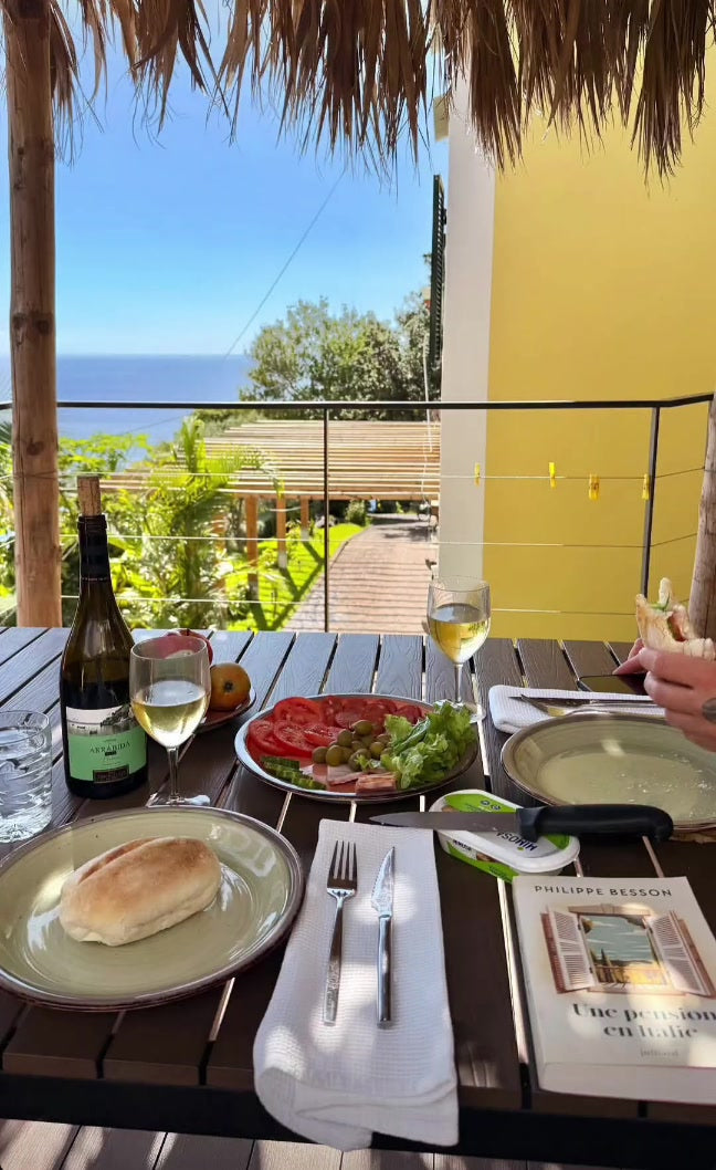 Lunch with wine on the sea view patio of the Dragon Tree Apartment