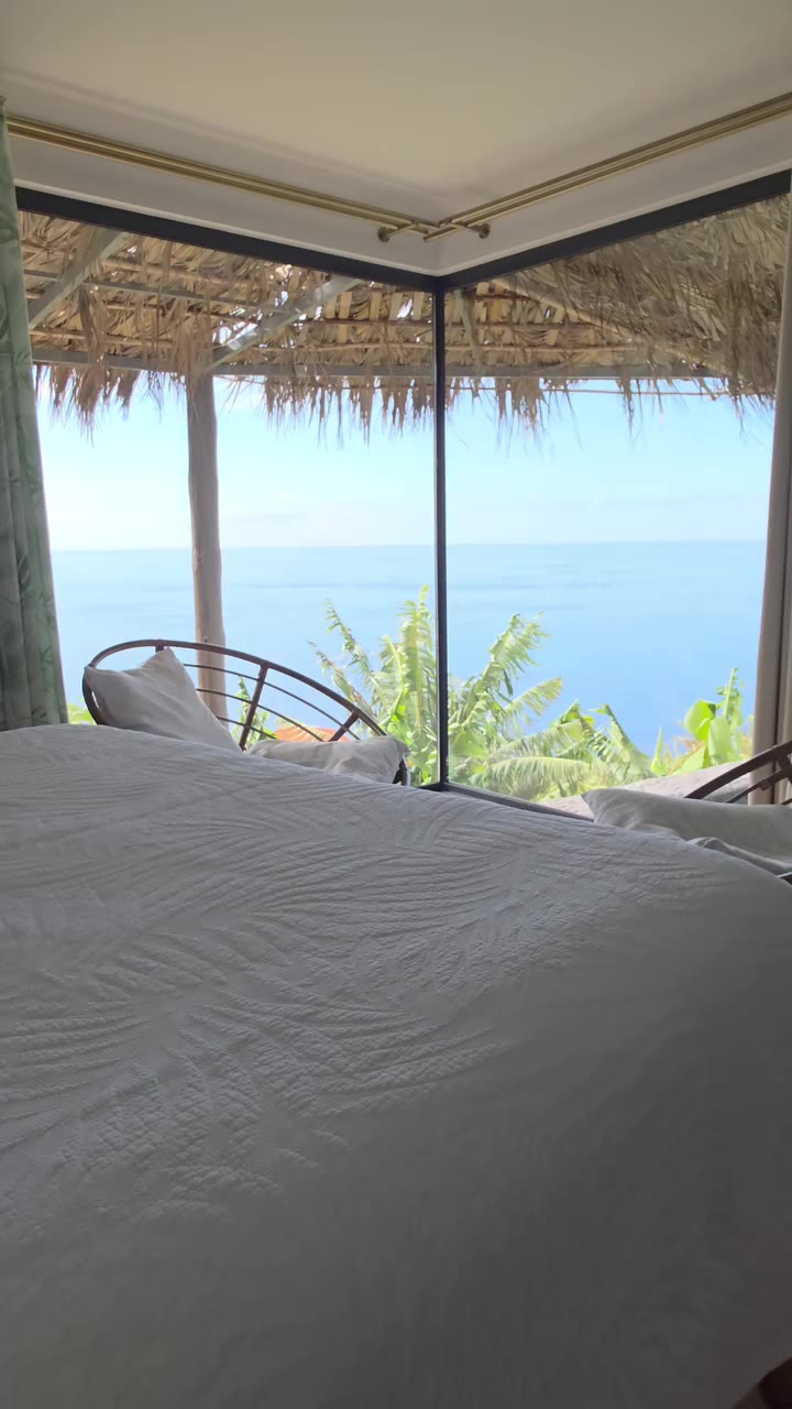 The bedroom of the Tropical Honeymoon Suite facing the sea