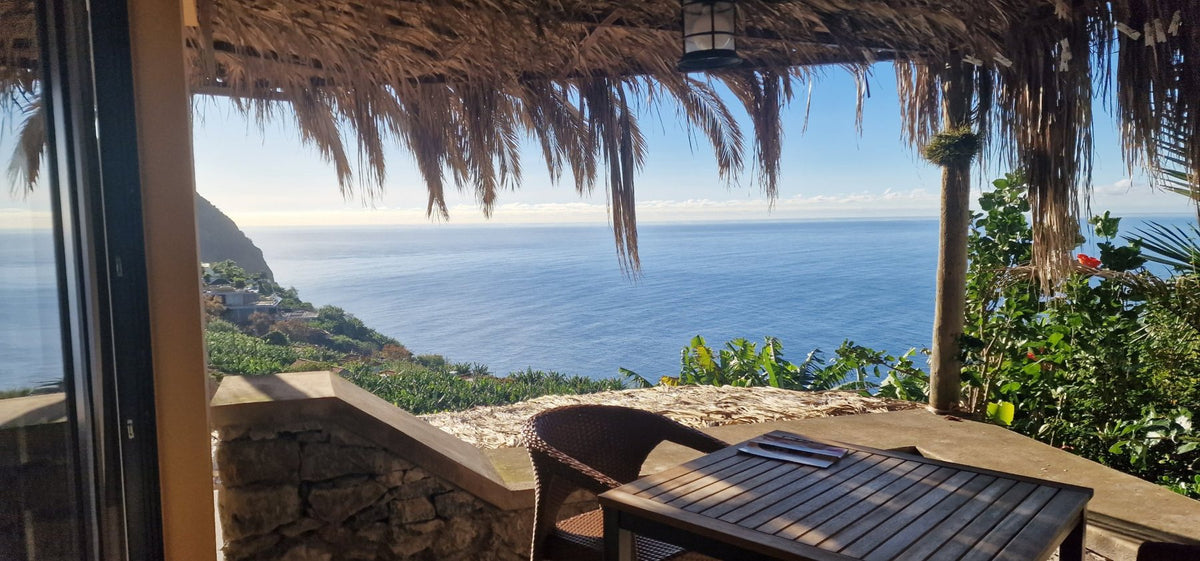 The patio table looking out to the cliffs and the sea